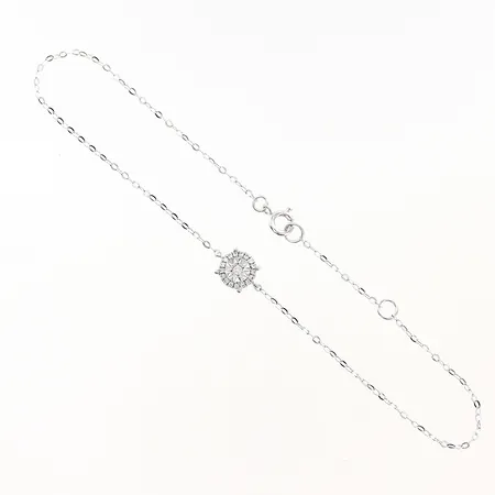 Armband diamanter 1 x ca 0,01ct 17 x ca 0,005ct längd 16,5-18,5cm bredd 1-5mm vitguld 18K  Vikt: 0,7 g