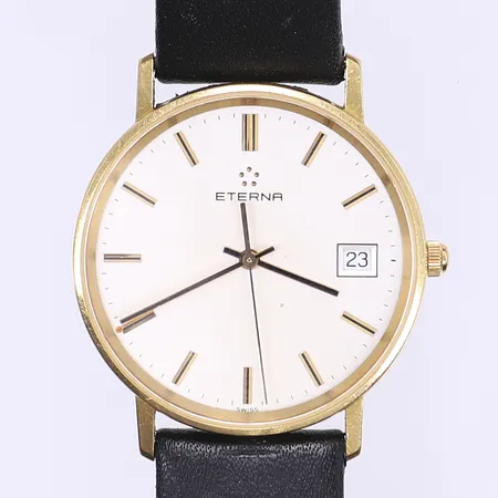 Herrur Eterna Quartz datum Ø33mm boett i 18K läderband går ej
