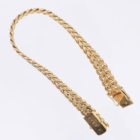 Armband fiskbensmönstrat längd 18,5cm bredd 11mm svenska stämplar 1966 kistlås 18K  Vikt: 40 g