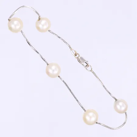 Armband med odlade pärlor längd 21cm bredd 1-8mm vitguld slitage på pärlorna 18K Bruttovikt: 6,3g Vikt: 6,3 g