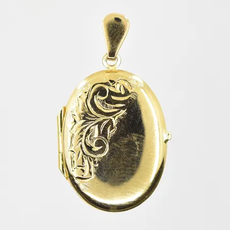 Hänge medaljong med blomdekor, längd 25mm, bredd 16mm, 18K. Vikt: 2,7 g