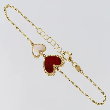 Armband med hjärtan längd 16-17,5cm bredd 1,2-13,5mm 18K. Vikt: 2,7 g