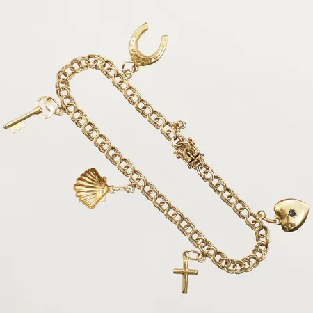 Armband Bismarck med fem berlocker längd ca 20cm bredd 4,7mm en berlock saknas 18K Vikt: 10,8 g