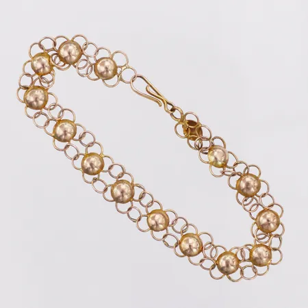 Armband missfärgad längd ca 18cm bredd ca 8mm 14K Vikt: 4,5 g