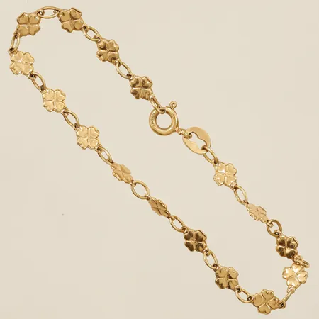 Armband med integrerade hängen blommor längd 14,5cm bredd 4,4mm 18K Vikt: 2,6 g