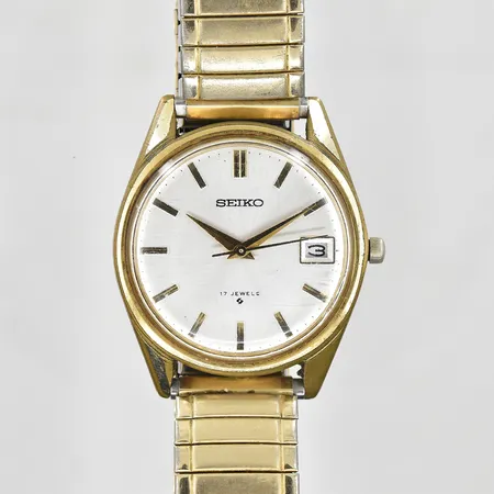 Herrur Seiko stål/doublé, manuell, datum, Ø35mm, refnr 6602-8050, serienr 431836, flexband, 1960-tal, fungerade vid testtillfället, inga tillbehör.