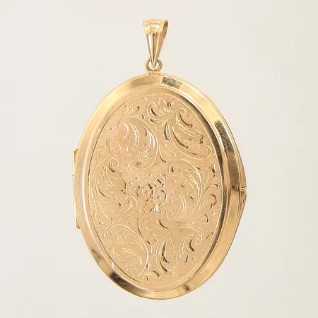 Hänge/medaljong med dekor samt fotogömma 50x31mm monogram på baksidan 18K Vikt: 11,1 g