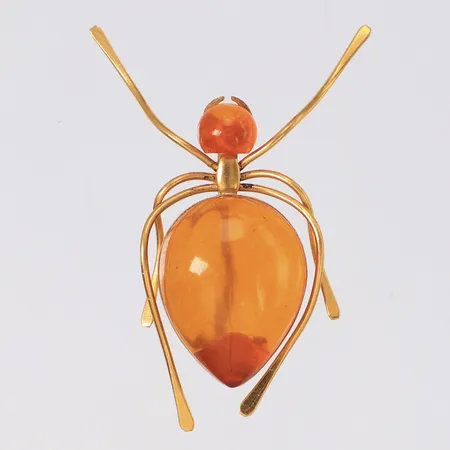 Brosch Spindel i gulmetall med orange stenar, längd 50mm, bredd 36mm, höjd 14mm, bijouteri Vikt: 0 g