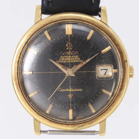 Armbandsur Omega Constellation chronometer, guld på stål, automatisk, 35mm, ref: 168.004-63, serienr: 20692835, cal.561, mineralglas, datum, 1960-tal, repig boett, repigt glas, sliten/ bortfall av ljusmassa, defekt läderband