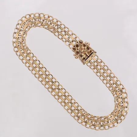 Armband X-länk längd 19,5cm, bredd 8,2mm, en låsåtta något glapp, Stockholms Ädelsmide Ab 1965, 18K Vikt: 10,8 g