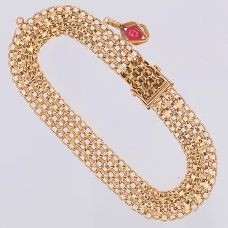 Armband X-länk längd 19,5cm bredd 10mm, hänge röd sten, en extra ögla, kattfot 18K Vikt: 15,8 g