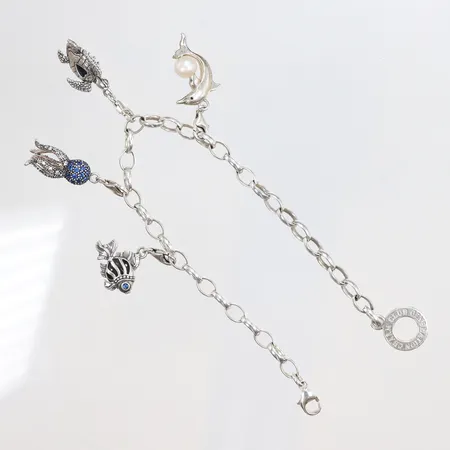 Armband Thomas Sabo med 4 berlocker, längd 22,5cm, bredd 5mm, 925/1000 silver Vikt: 21,7 g