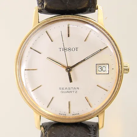 Herrur Tissot Seastar quartz 14K Ø33mm datum, läderband med slitage samt ej original, boett samt glas med mindre repor, i behov av batteribyte, box, inga övriga tillbehör