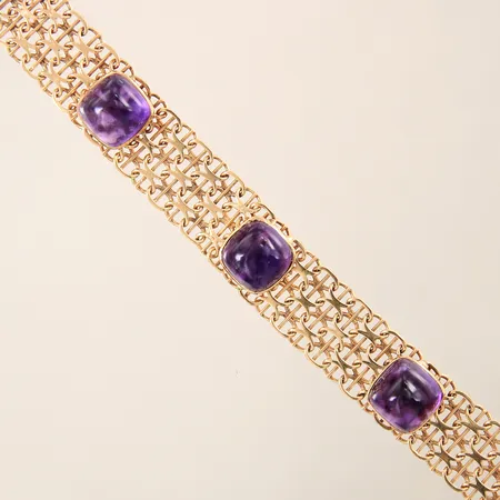 Armband X-länk med stav med ametister längd 19cm bredd 13mm, en sten med nagg, 18K Vikt: 30,2 g