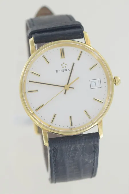 Herrur Eterna diam 33 mm, graverad 18K, fungerar. 