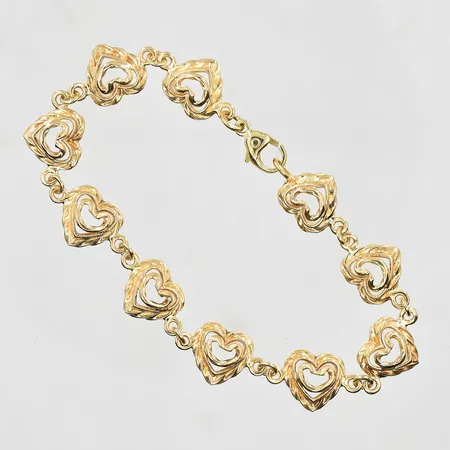 Armband med hjärtformade länkar, längd 18cm, bredd 10mm, 14K. Vikt: 13,2 g