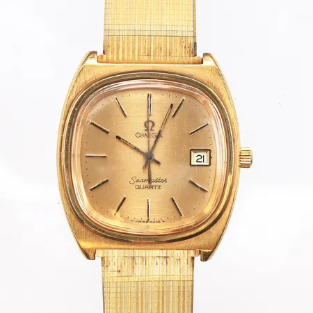 Herrur Omega seamaster, 36mm, quartz, boettnr:1960081, cal 1341, snr: 40 760386, guld på stål med metallband, repigt plexiglas, batteri byte krävs, service behov, inga tillbehör.