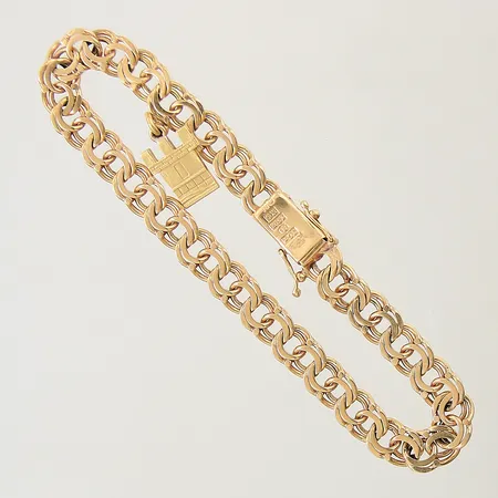 Armband Bismarck med integrerad berlock längd 19cm bredd 6,8mm 18K Vikt: 16,1 g