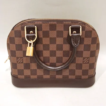 Väska Louis Vuitton Alma BB Damier Ebene Canvas, datumkod: AR2260, mått: 23,5x17,5x11,5cm, beslag i guldfärgadmetall, lås samt nycklar, saknar axelrem, en fläck på insidan av väskan, inga andra tillbehör