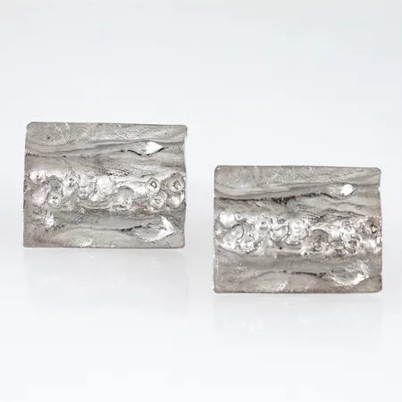 Manschettknappar i silver. Motiven är 29,4 x 23,1 mm. 25,7g 925/1000.