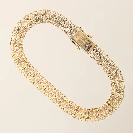 Armband X-länk med stav längd 19,5cm bredd 8,1mm 2 länkbitar vid lås något böjda 18K Vikt: 11 g