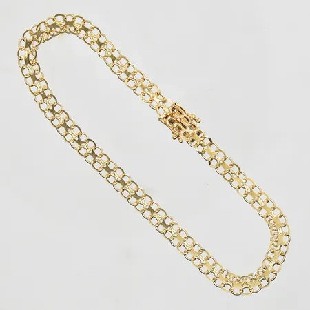 Armband X-länk längd 21cm, bredd 5mm, mindre klämskada på länk, 18K. Vikt: 6,4 g