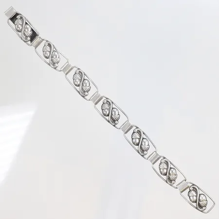 Armband med dekor 19cm bredd 12mm GK (Ge-Kå-Smyckek G Kaplan) Stockholm 1952 silver 830/1000 Vikt: 11,1 g
