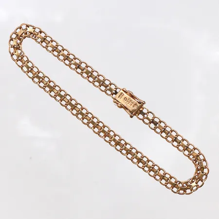 Armband, längd 19cm, bredd 4,8mm, bruksslitage i låset, 18K. Vikt: 7,5 g