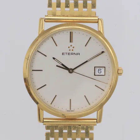 Armbandsur Eterna 18K, quartz, 33,5mm, refnr 158.4272.68S, datum, gravyr, går ej, armband Korridor 18K ca 19cm, bruttovikt 70,1g, inga tillbehör.