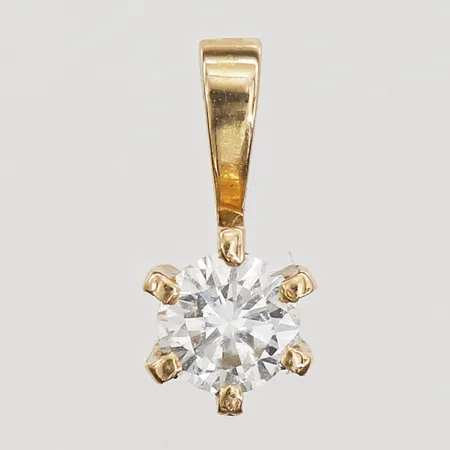 Hänge med diamant 1 x ca 0,20ct, längd 10mm, bredd 2-5mm, 18K. Vikt: 0,6 g