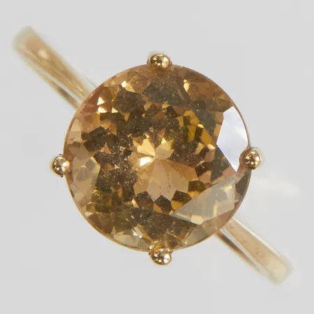Ring med en gröngulbrun zoisit Ø9,4mm, stl:17¼, bredd 1,5-9,4mm, 9K Vikt: 2,1g Vikt: 2,1 g