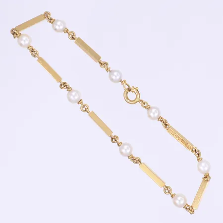Armband med pärlor 19cm bredd 5mm 18K Bruttovikt: 7,2g Vikt: 7,2 g