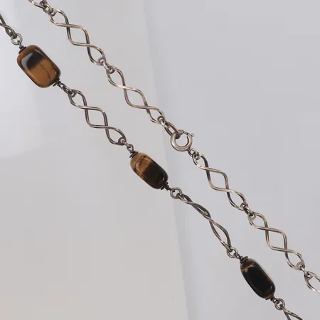 Collier med tigeröga längd 61cm, bredd 5-9mm, 835/1000 silver Vikt: 24,7 g