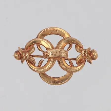 Brosch, längd 25,7mm, bredd 37,5mm, skev, 18K  Vikt: 2,6 g