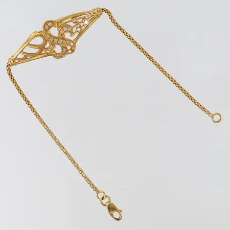 Armband med stenar halvstelt längd 18,5cm bredd 1,8-17,3mm stenar saknas 21K.  Vikt: 6,3 g