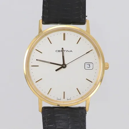 Armbandsur Certina 18K, quartz, 33,5mm, refnr EOL 158.9289.68, serienr M2C 2TZ YVJ, datum, går ej, gravyr, defekt krona går ej att ställa tiden, läderarmband, inga tillbehör.