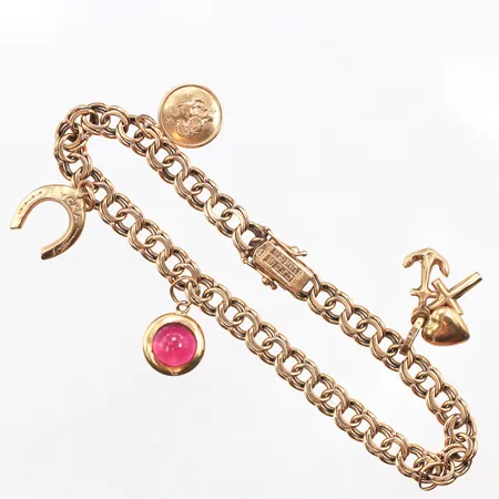 Armband Bismarck med fyra berlocker samt ögla för en till, 19cm, bredd: 5,7mm, 18K Vikt: 15,6 g