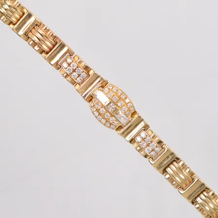 Armband längd 17,5cm, bredd 9,8mm-14,8mm, små vita stenar, 14K Vikt: 20,1 g