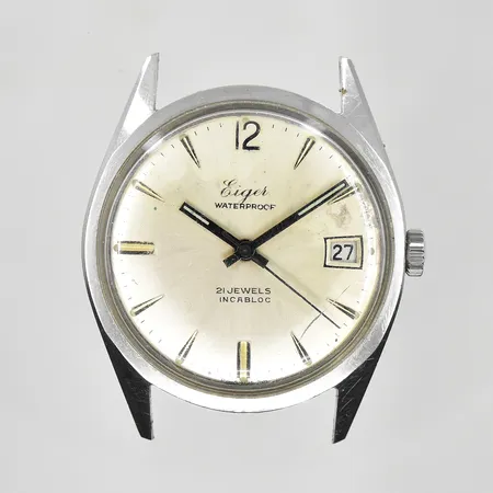 Herrur Eiger stål, Ø34mm, manuell, datum, defekt uppvridning, fungerar att ställa tid, defekt urtavla, repigt glas, inga tillbehör.