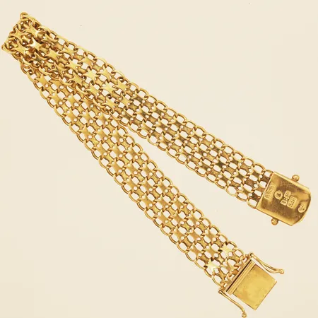 Armband X-länk längd ca19,5cm bredd 11,8mm år 1968 18K Vikt: 18,9 g
