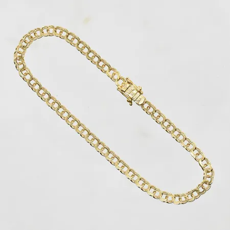 Armband Bismarck längd 19½cm, bredd 4mm, slapp låsåtta, 18K. Vikt: 5,4 g