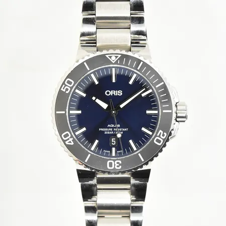 Herrur Oris Aquis date stål, automat, Ø43 mm, datum, blå urtavla, safirglas, refnr 7730, serienr 36-42003, cal 733, bruksskick, extra länkbitar, cert 25/11-2017 Stjärnurmakarna, manual, box, ytterkartong.