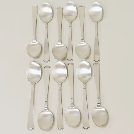 12 bordsskedar Rosenholm ca 18cm, nyskick, plastskydd och tyglinda medföljer, GAB, silver 830/1000. Vikt: 492,3 g