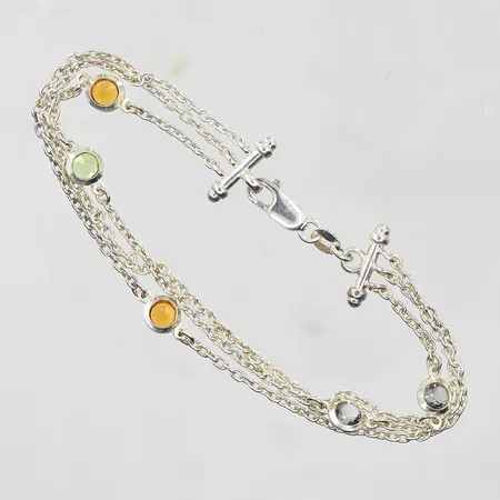 Armband med färgade stenar längd 19cm, bredd 5-10mm, treradigt, silver 925/1000. Vikt: 6,7 g