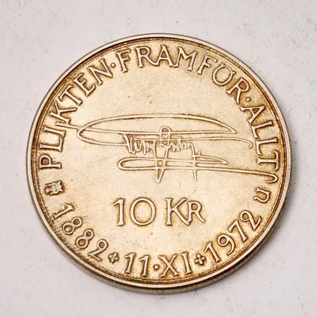 Minnesmynt 10 kronor - Gustaf VI Adolf, "Plikten Framför Allt", 1882, ca Ø32mm, 830/1000 silver, 17,99g.