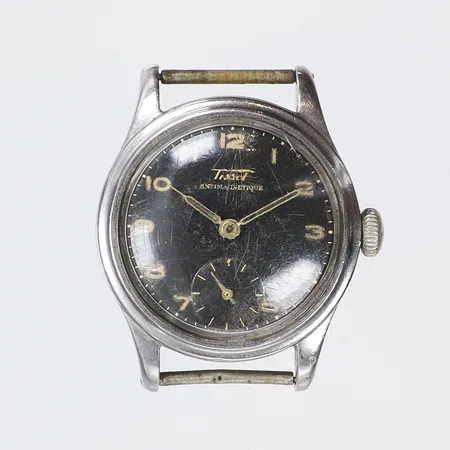 Herrur Tissot Ø31mm manuell uppdragning (går kort men stannar snabbt, servicebehov) fläckig urtavla, ca 1950-tal