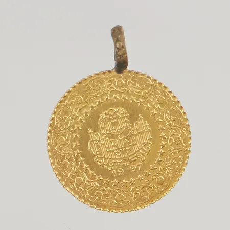 Hänge 18mm Atatürk öglan oädel 21K 1,9g. Skickas med postpaket.