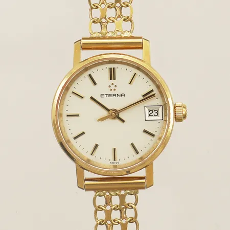 Damur Eterna guld quartz Ø21mm armband inklusive boetten 18½cm gravyr repor 18K bruttovikt 18,5g