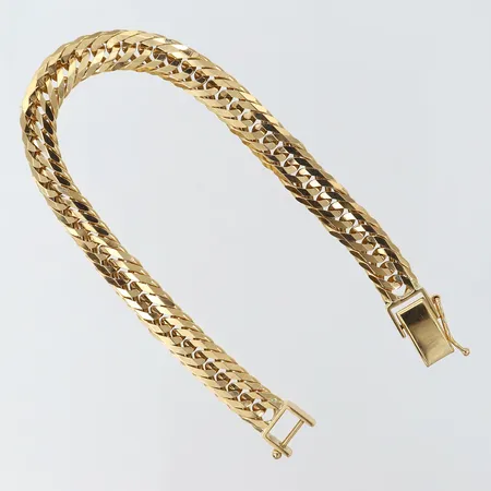 Armband längd 18,5cm bredd 7,5mm 18K. Vikt: 28,1 g