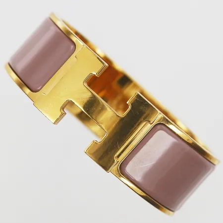 Armband Hermés Clic Clac H, gulmetall med rosa emalj, märkt Hermés FI 01 27 Made in France, innermått ca 56x47mm, kvitto från Hermés Hamngatan, Stockholm år 2018, manual, repor, trögt lås, dustbag, originaletui,
